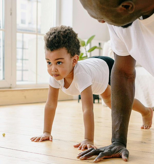 Child and Father doing pushups
